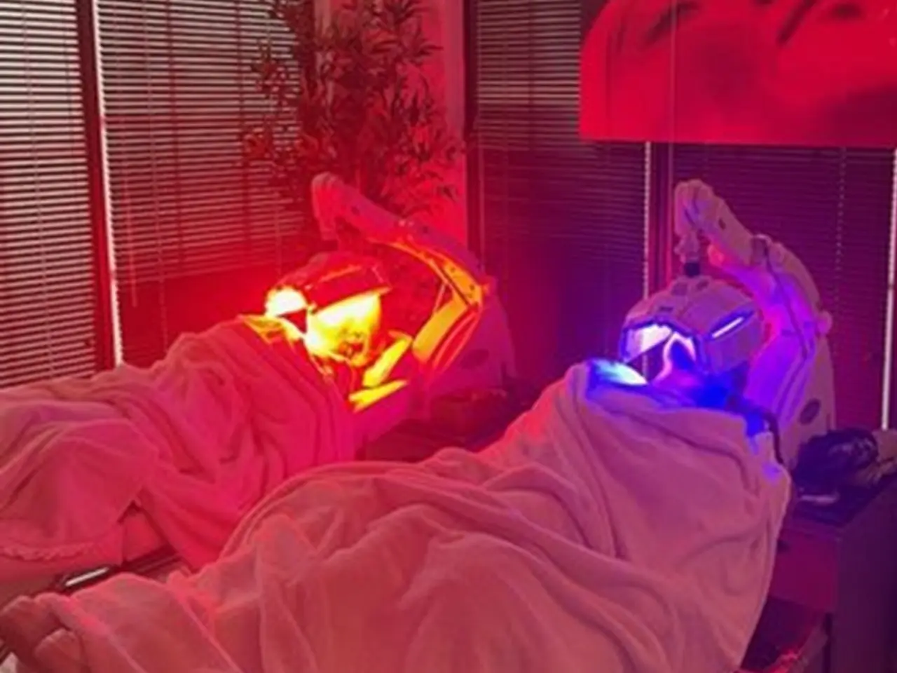 LED Red and Blue Two people laying in bed with red and blue lights